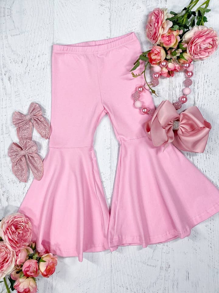 Pantalon rose clair à bas en forme de cloche pour la vente par The Hair Bow Company