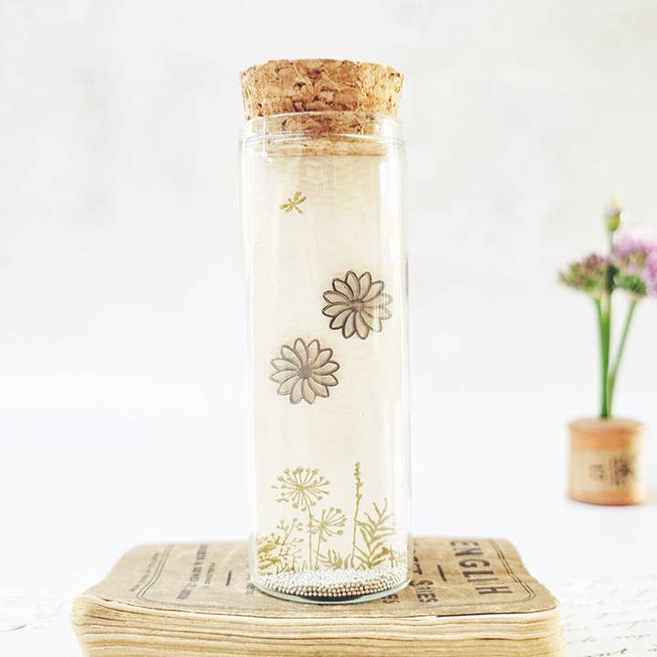 Daisy stud earrings in a bottle with a bee print. for wholesale by Zamsoe