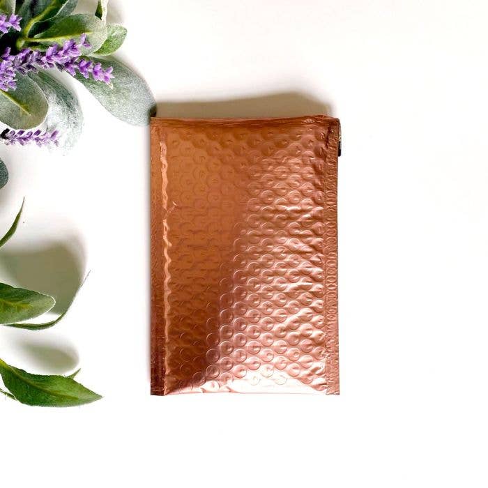 4.25x8 Rose Gold Metallic Poly Bubble Mailers for wholesale by Eleven Fashion