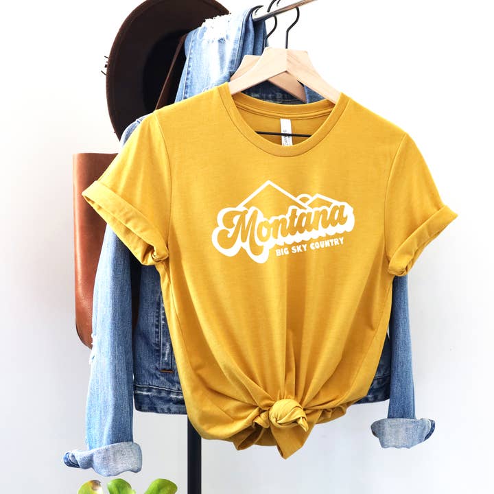 LADIES MONTANA BIG SKY COUNTRY TEES (MULTIPLE COLORS) for wholesale by Back Road Designs