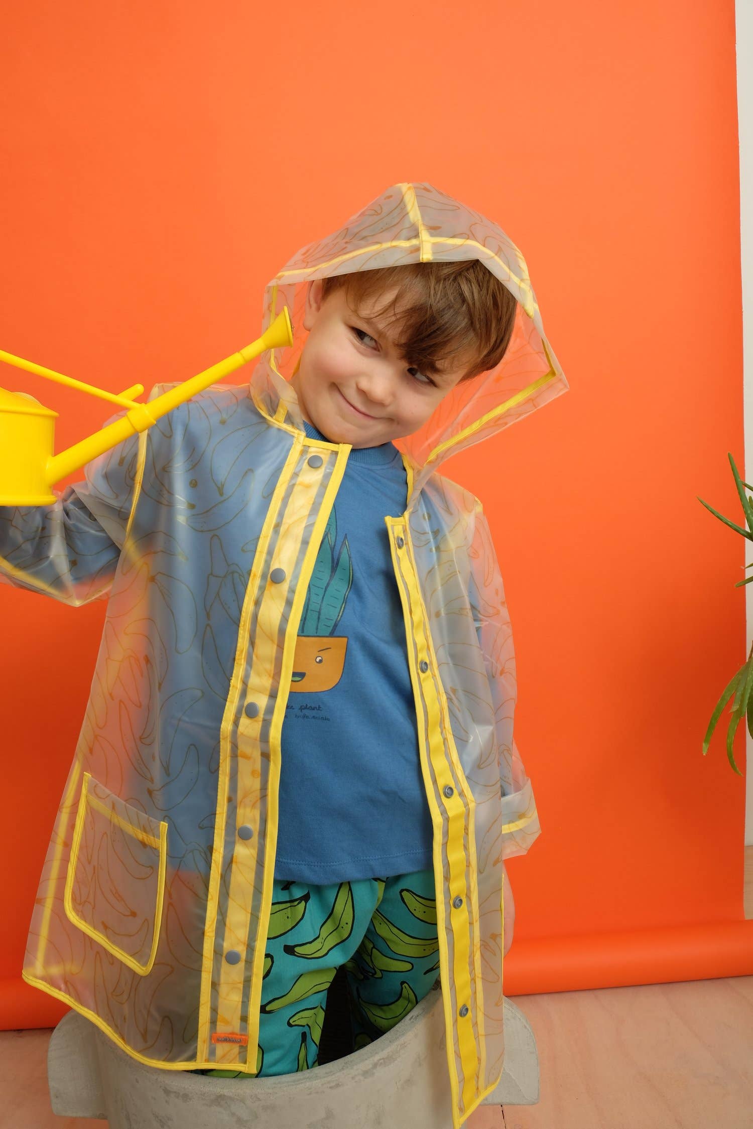 Indikidual – Engroshandel Regnfrakke – til børn – Bananprint Gennemsigtig regnMac med lommer3