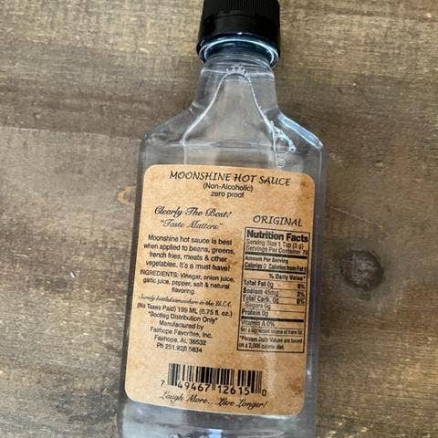 Fairhope Favorites, Inc. - Wholesale Pikante saus - Catch & Release My Ass Moonshine Hot Sauce Label - Origineel2