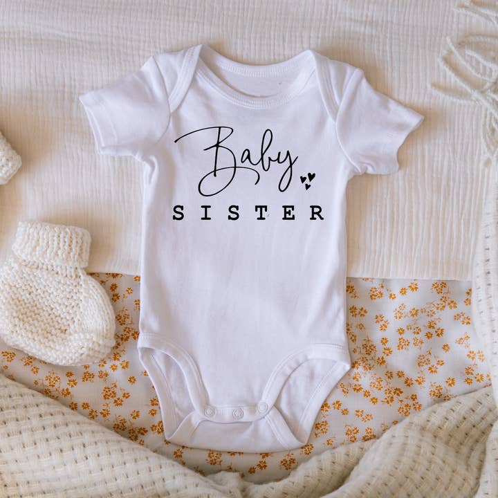 Baby Sister Pregnancy & Gender Reveal Onesie for wholesale by Claire and Bella