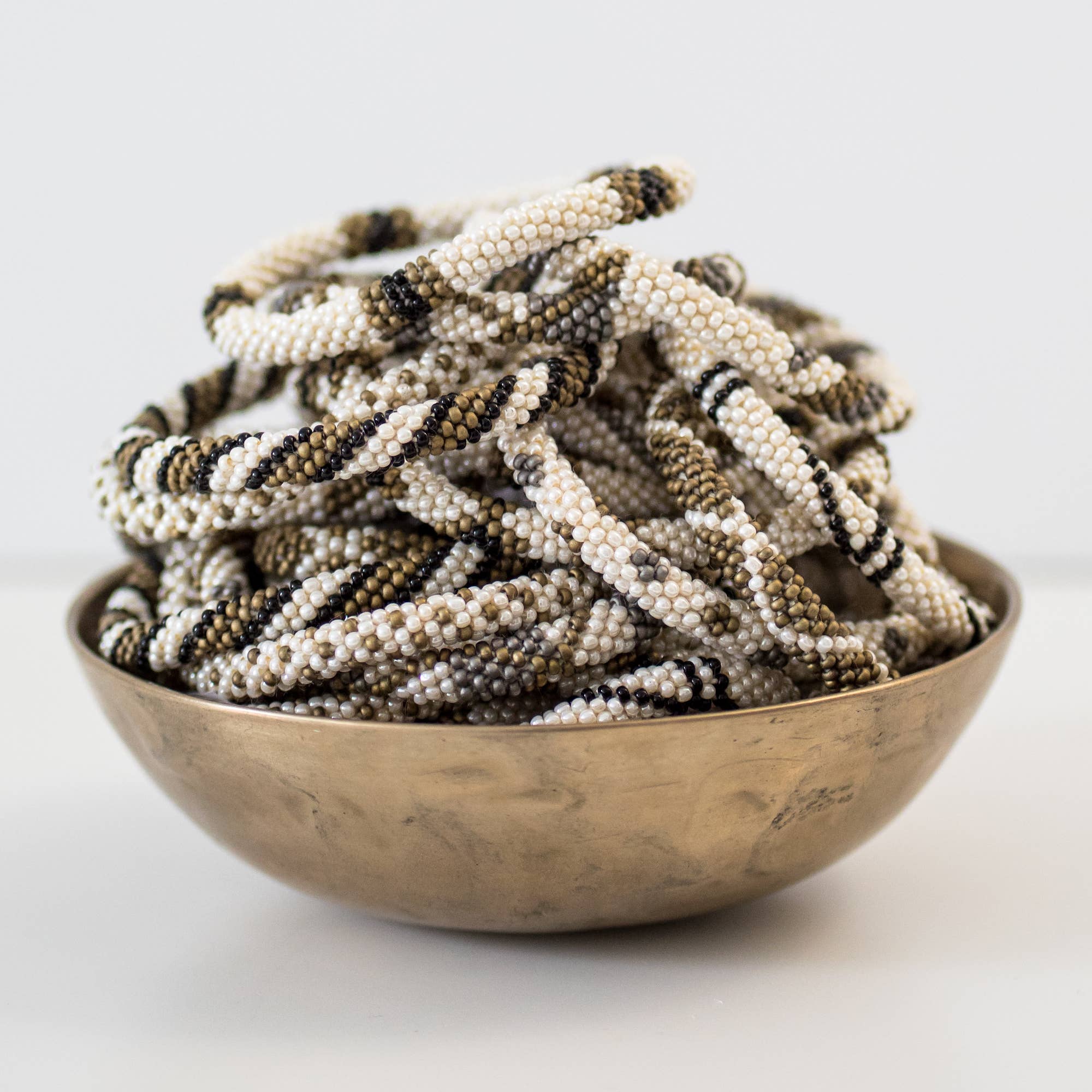 Aid Through Trade - Wholesale Jewelry Set - Roll-On® Bracelets Khaki - Set of 122