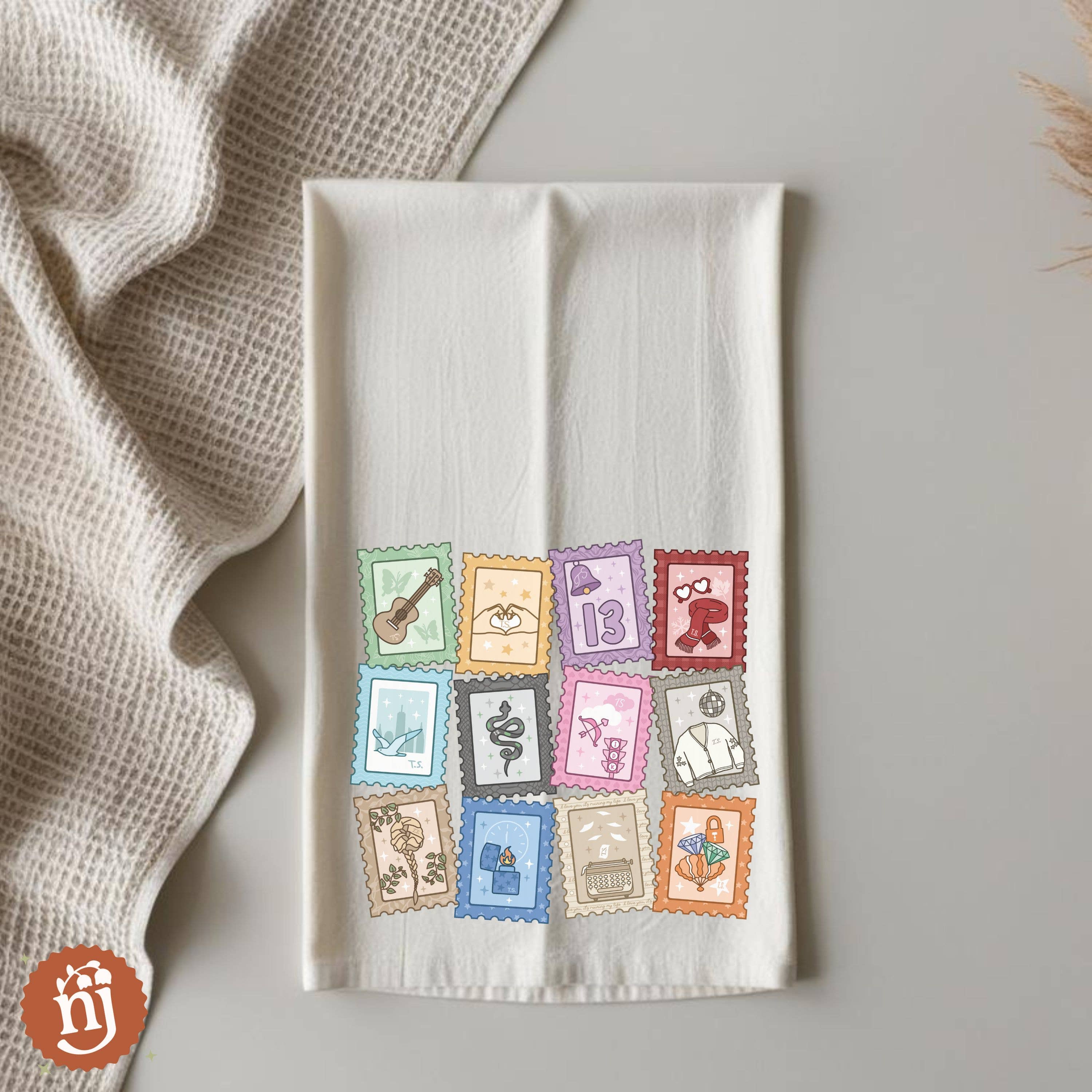 Nearly June Design Co - Wholesale Tea Towel - Eras Inspired Stamps Tea Towel 1