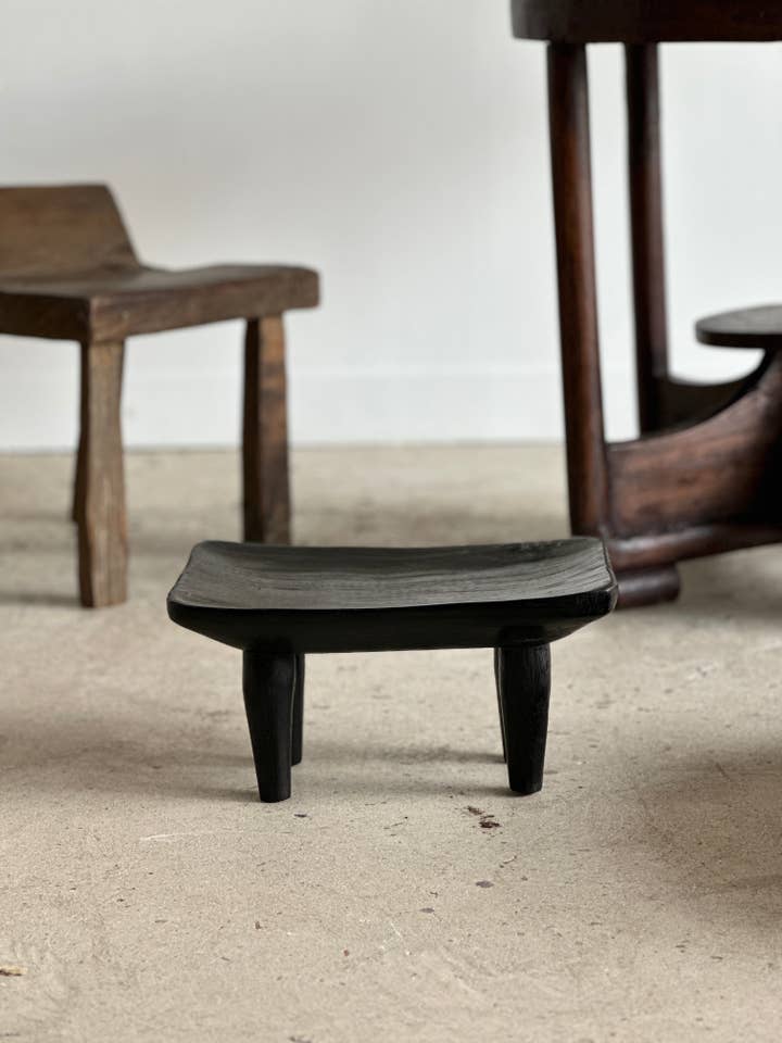 Small monoxyle quadripod stool in black mango wood for wholesale by Office Objets