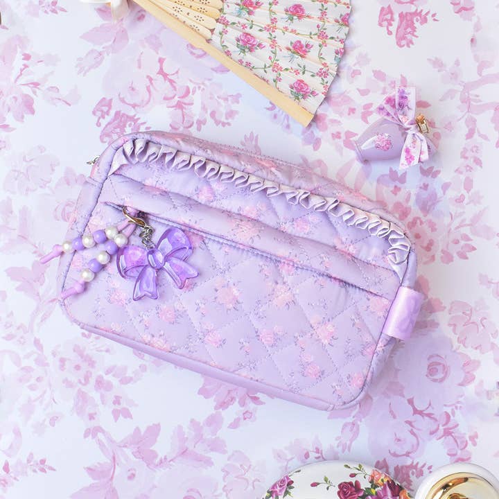 Pochette matelassée à imprimé floral avec breloque pour la vente par OMG Accessories