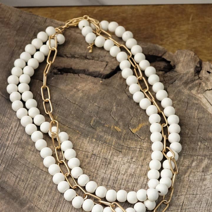 Multi Strand Wood Beads Short Statement Cross Necklace Cream for wholesale by PennyLine inc