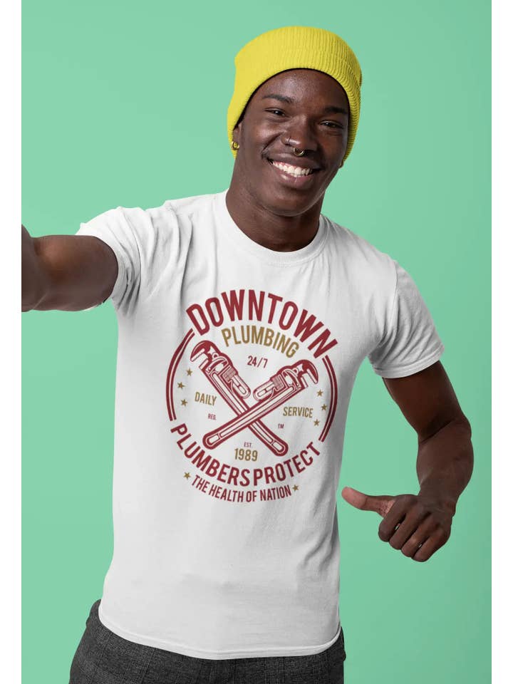White ULTRABASIC Men's T-Shirt Downtown Plumbing - Plumbers Protect Since 1989 - Health of Nation for wholesale on Faire1