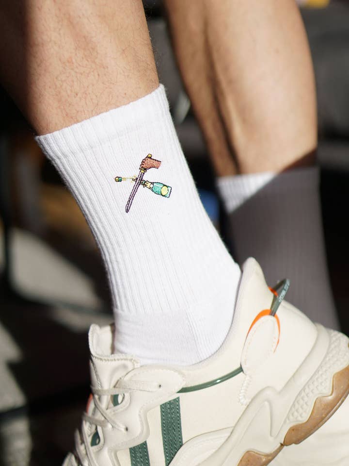 Champagne Sabre | Embroidered organic cotton socks for wholesale by Fashion Drinks
