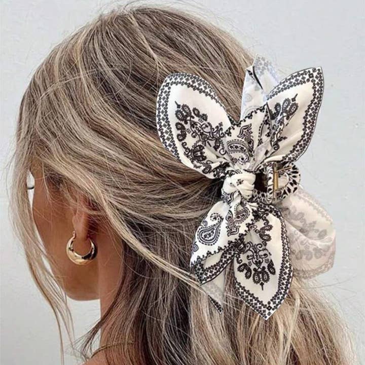 Black Double Sided Cashew Fower Heart-shaped Bow Hair Clip for wholesale on Faire