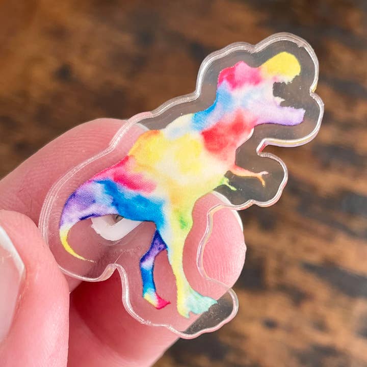 Rainbow T-Rex Acrylic Pin for wholesale by The Unrefined Crafter