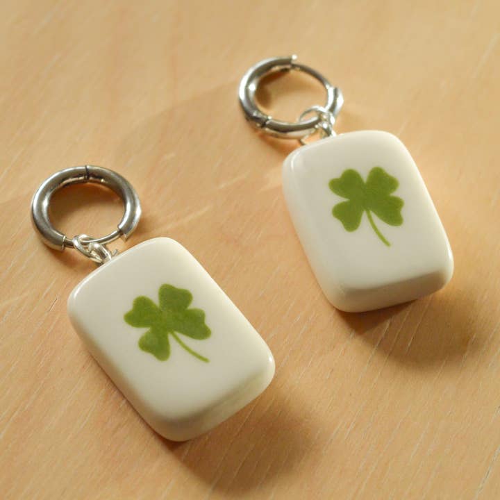 Huggie Earrings with Green Clover Charm - Gold or Silver for wholesale by Jake Thomas Parker