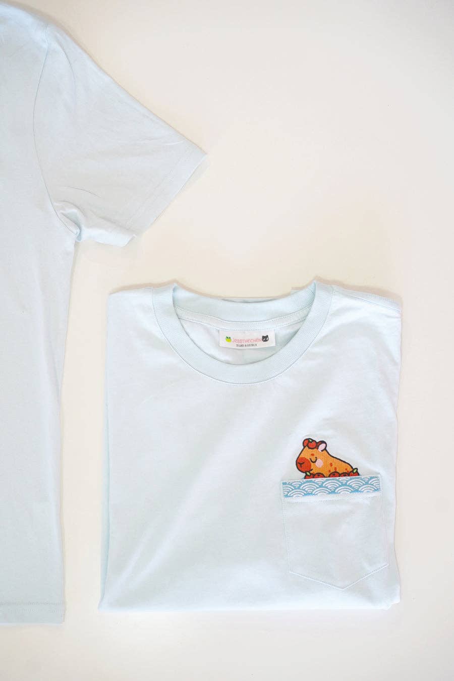 Jessthechen - Wholesale T-Shirt - Unisex - Bathing Capybara Embroidered Pocket Tee | Sky Blue3