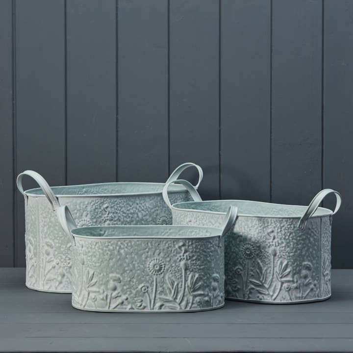 Set Of Three Sage Oval Zinc Planters With Floral Design for wholesale by Satchville