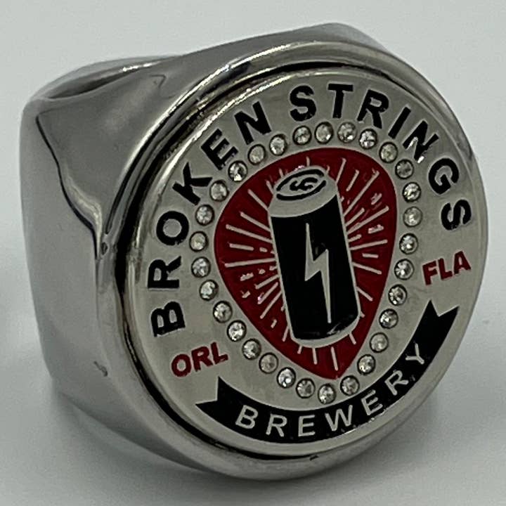 The deCAPitator Broken strings brewery ring bottle and can tab opener! for wholesale by Brassa Inc. The deCAPitator ring bottle & can tab opener