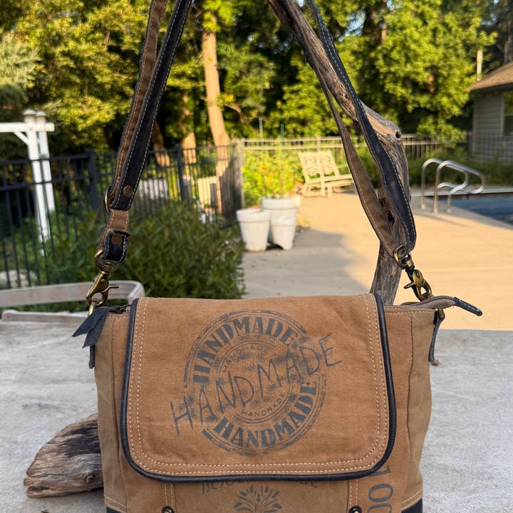 Vintage Military Tent Canvas Crossbody Bag – Eco-Conscious and other Purchase Wholesale recycled military canvas bags. Free Returns & Net 60 Terms on Faire trending on Faire.