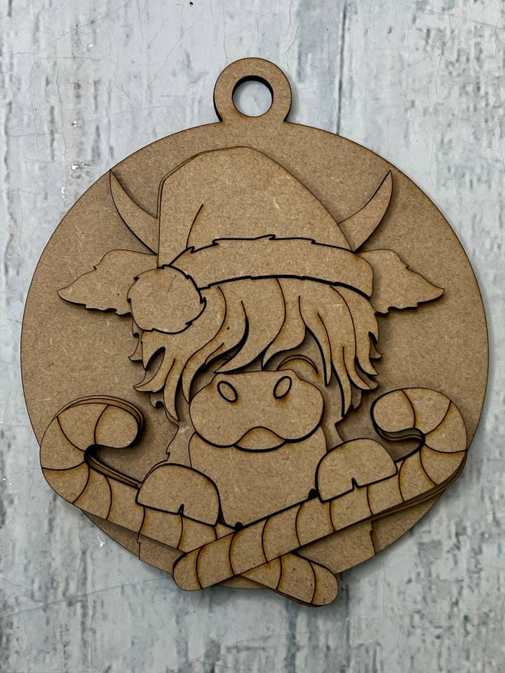 Christmas candy cane Ornament highland cow for wholesale by Rustic Home Co LLC