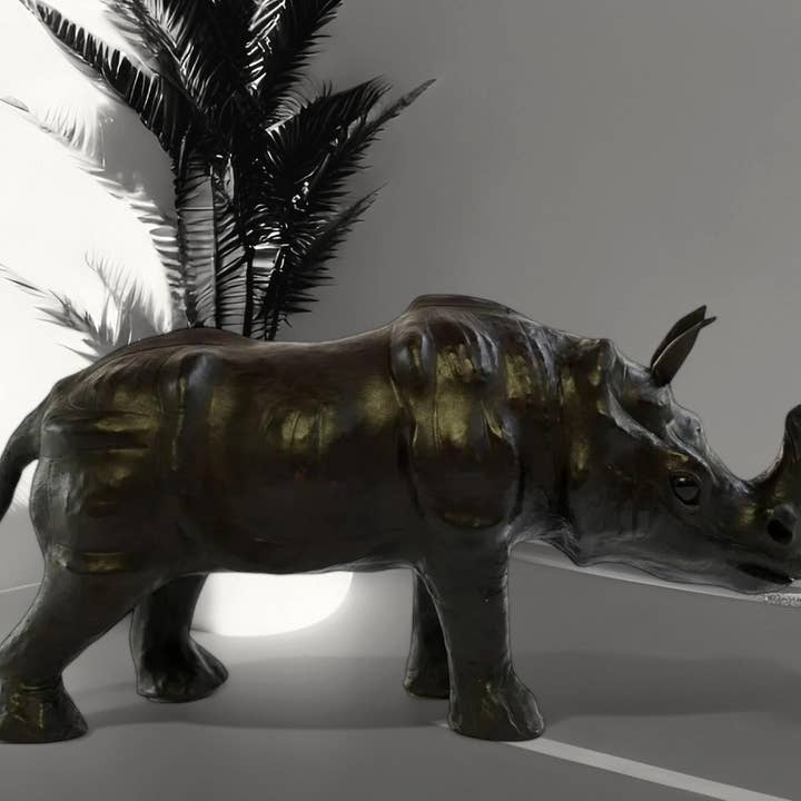 Handmade Leather Rhino Statue | Eco-Friendly Wildlife Figurine | Indian Artisan Safari Home Decor for wholesale by Something wild