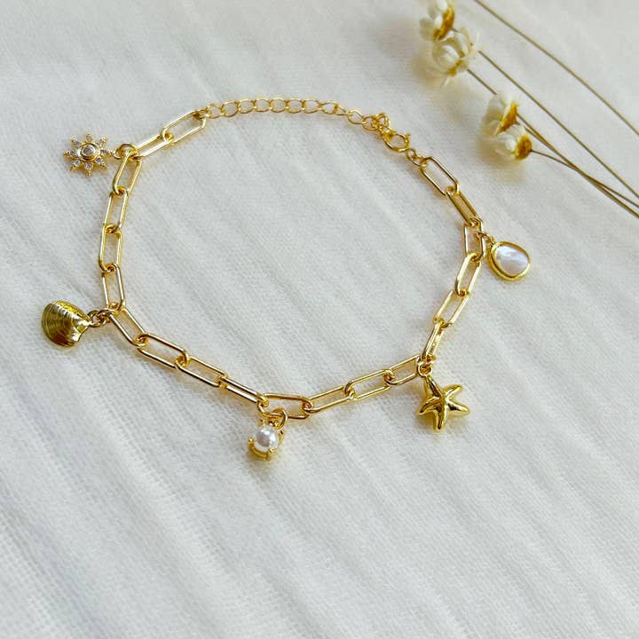Gold Seashell Charm Bracelet for wholesale by KARA | TOZER