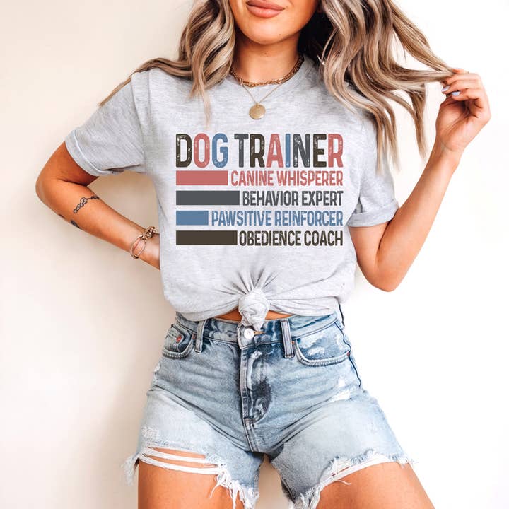 Dog Trainer Canine Whisperer Behavior Expert Pawsitive Reinforcer Obedience Coach DTF Heat Transfer for wholesale by Trendy Transfers