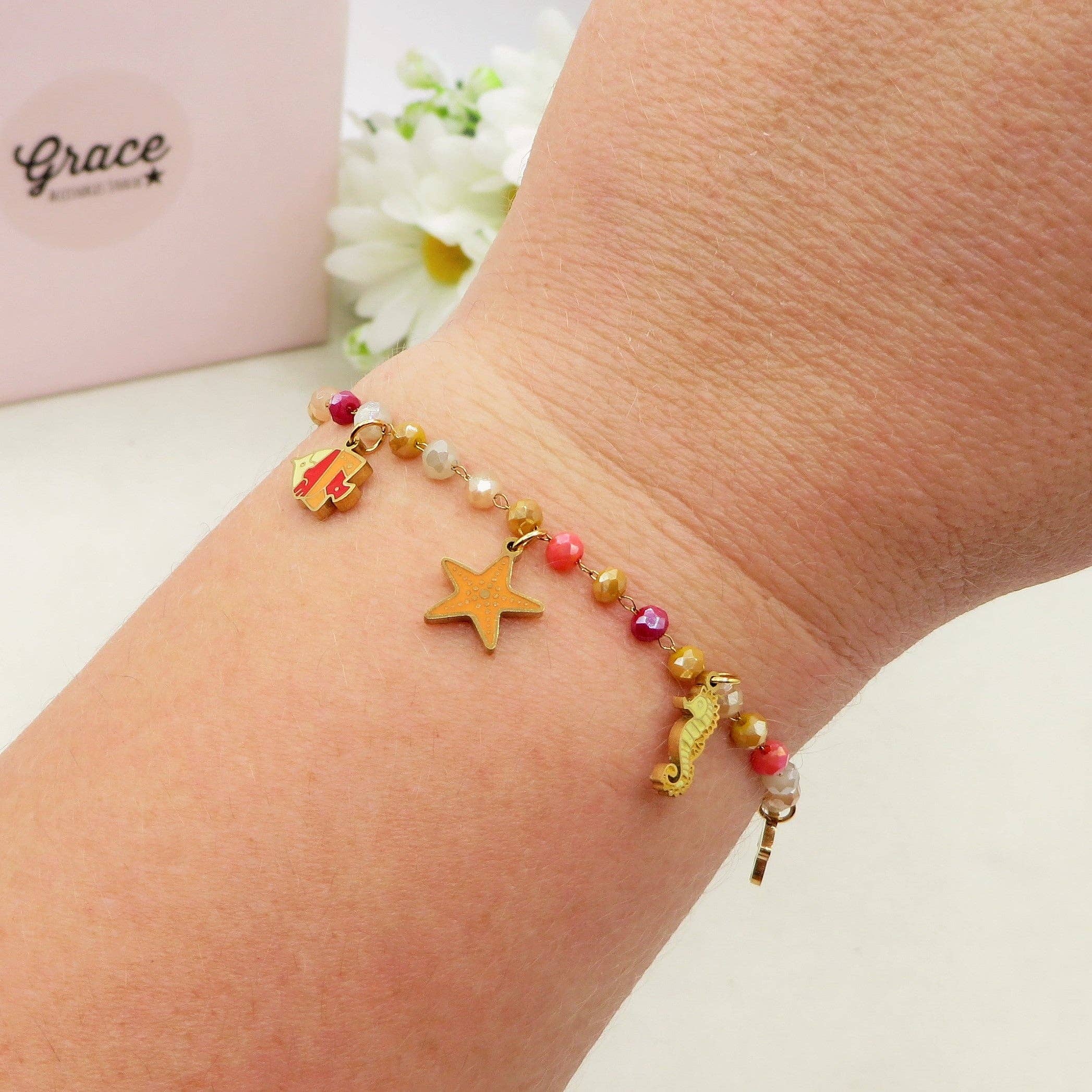 BIEGE COCCIO MAORI ~ Bracciale ACCIAIO INOSSIDABILE con cristalli e ciondoli marini for wholesale on Faire3