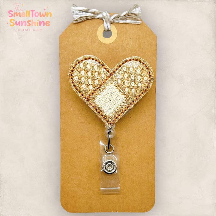 Bandage Heart Badge Reel for wholesale by The SmallTownSunshine Company