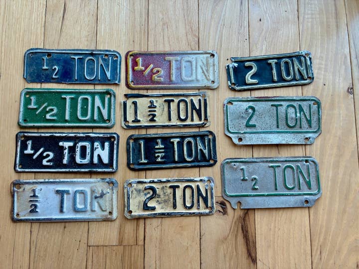 11 Vintage Metal Tonnage/ Ton License Plate Tabs for wholesale by RusticPlates