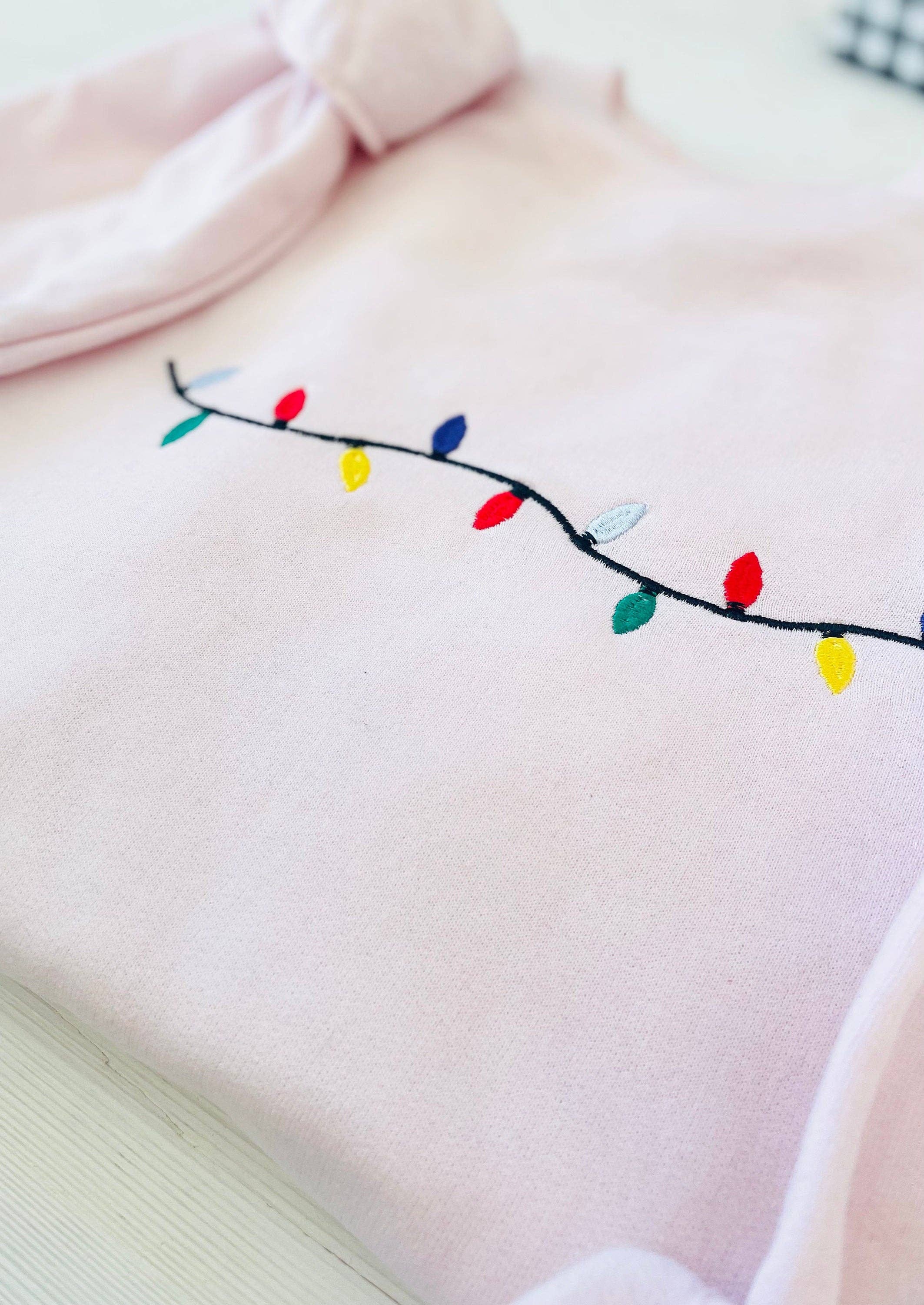 Light Pink Christmas Lights Embroidered Sweatshirt for wholesale on Faire1