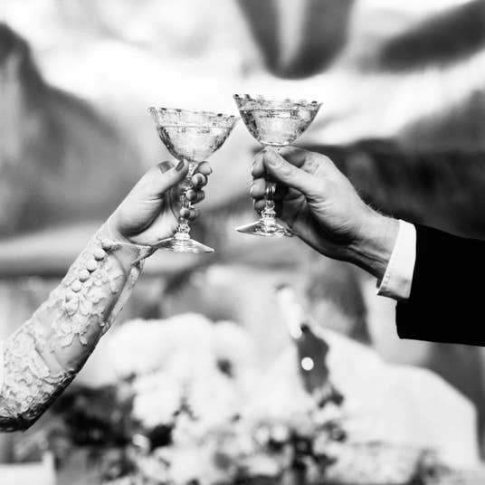 Toasting wedding with two glasses blank greetings card for wholesale by Inky Blue Ltd t/a Holy Mackerel