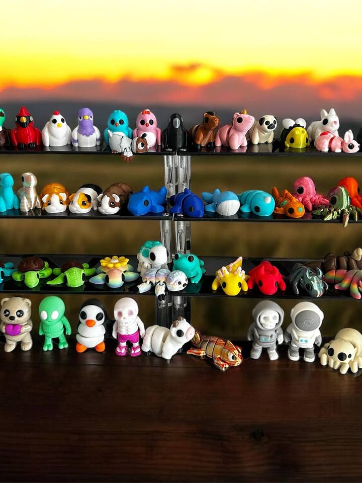 Bundle of 200 Mini 3D printed fidget toys articulated pets for wholesale by 3D in Paradise