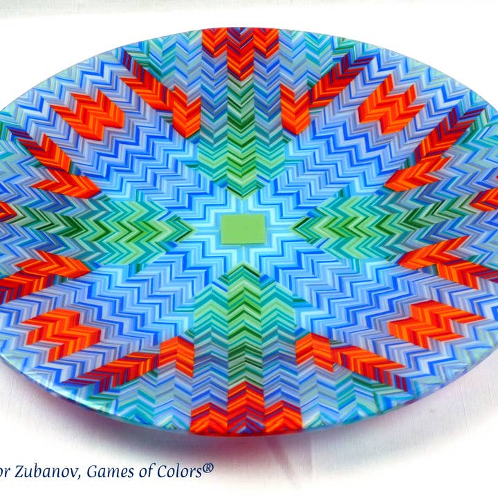A round glass platter "Green Energy" for wholesale by Games of Colors