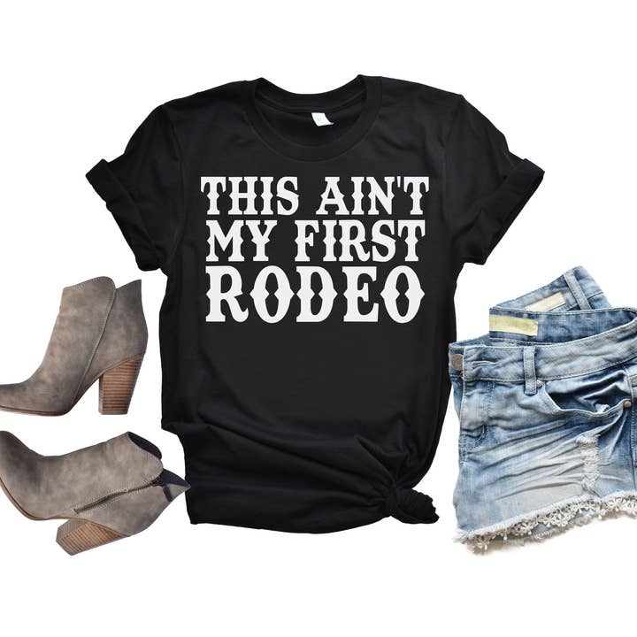 Simply Tees - Wholesale Screen Printed T-Shirt - Women's - This Ain't My First Rodeo Black Tee White Ink