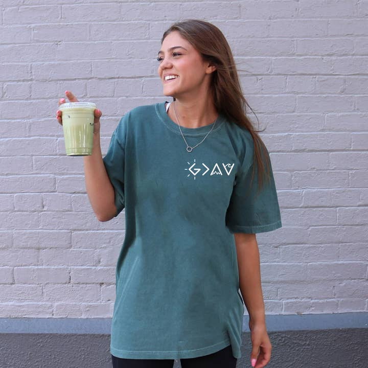 GOD IS GREATER THAN OUR HIGHS AND LOWS UNISEX TEE for wholesale by Dwell Apparel