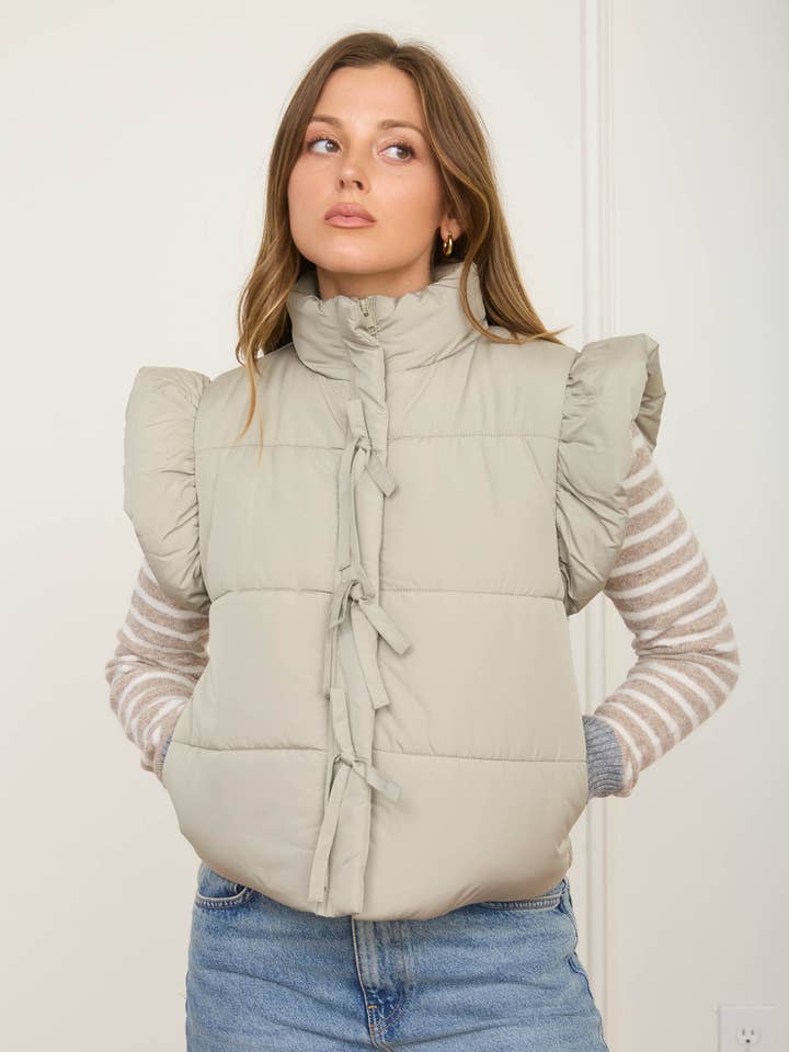 FLUTTER SLEEVE BOW DETAIL ZIP-UP PUFFER VEST for wholesale by Blu Pepper