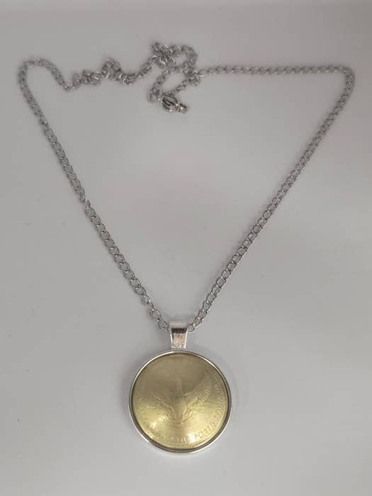 "Elbows Up" Lucky Loonie Necklace for wholesale by Lost Things Artisan Jewelry