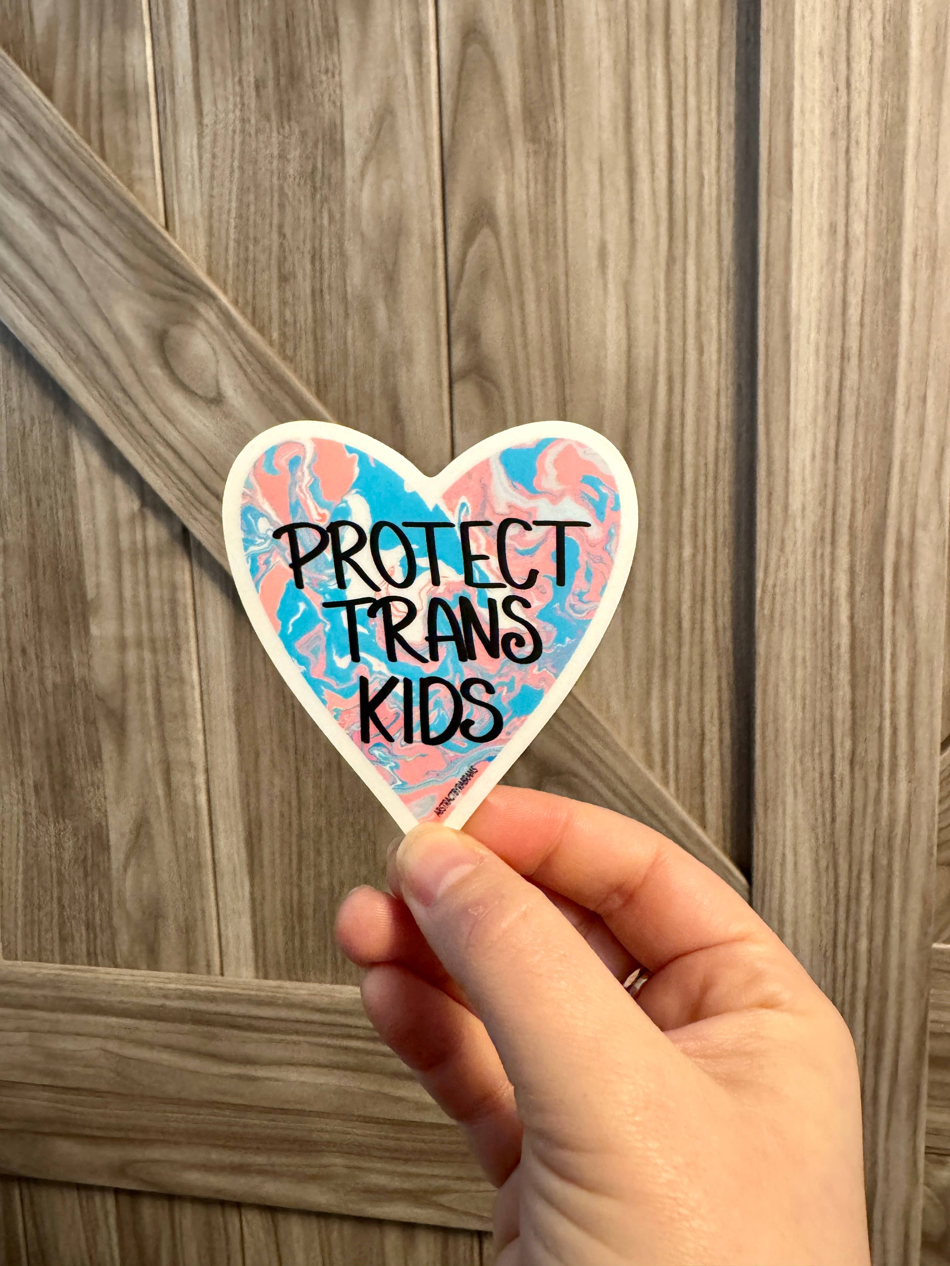 AbstractbyRabrams - Wholesale Sticker - Protect Trans Kids Heart Shaped Matte Vinyl Sticker LGBTQ2