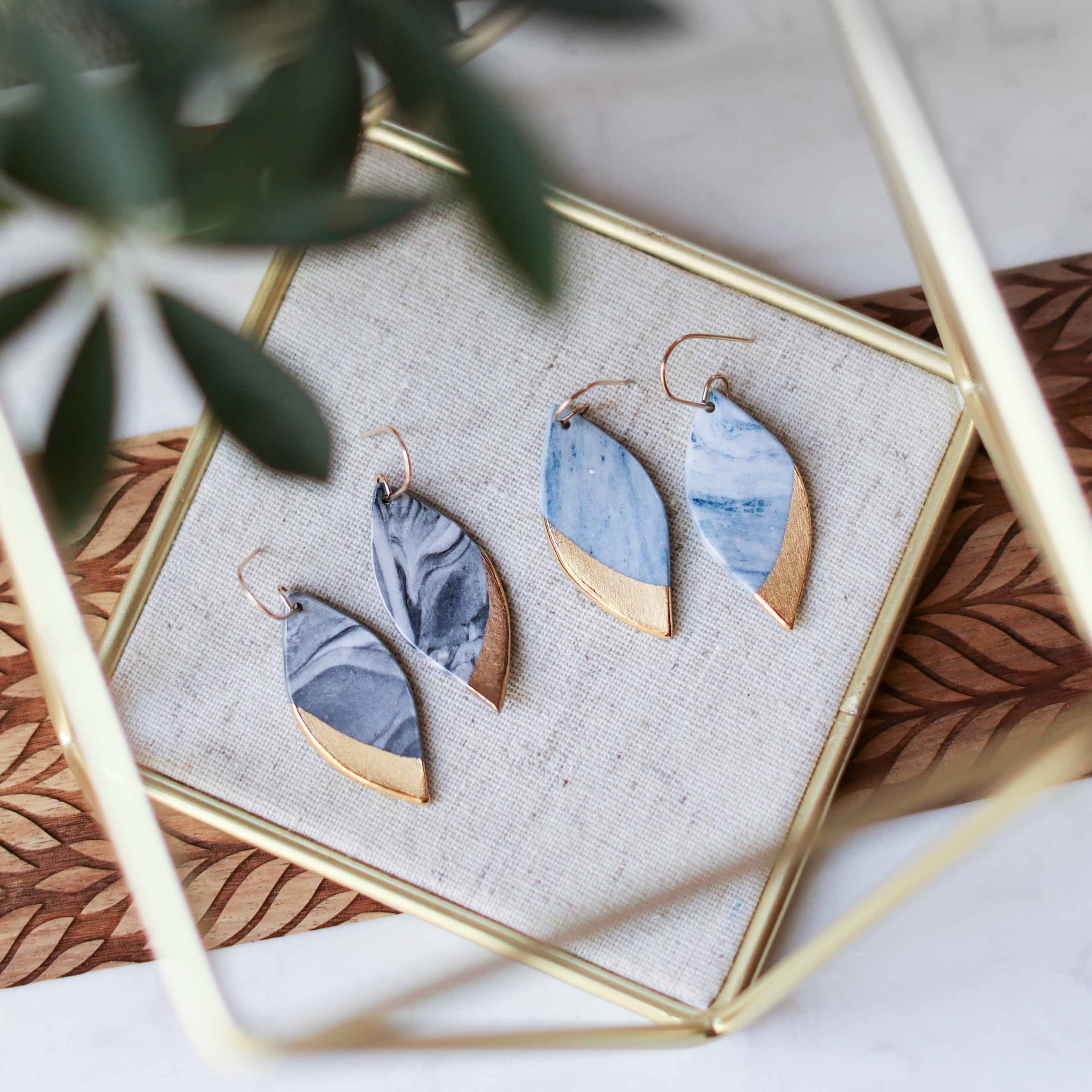 Remnant Studios - Wholesale Dangle Earrings - granite - black and blue marbled leaf earrings