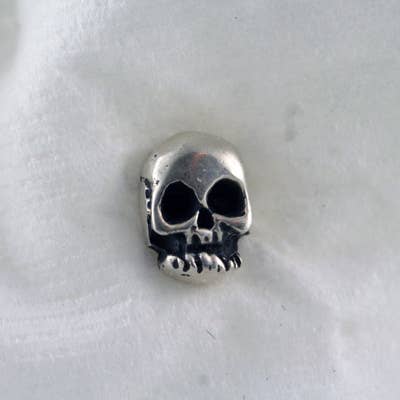 Tiny Sterling Silver Skull Stud Earrings for wholesale by Moosepablos, Inc.