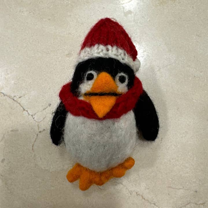 Handmade Felt "Penguin Pepe" ornament and other Purchase Wholesale penguin ornament. Free Returns & Net 60 Terms on Faire trending on Faire.