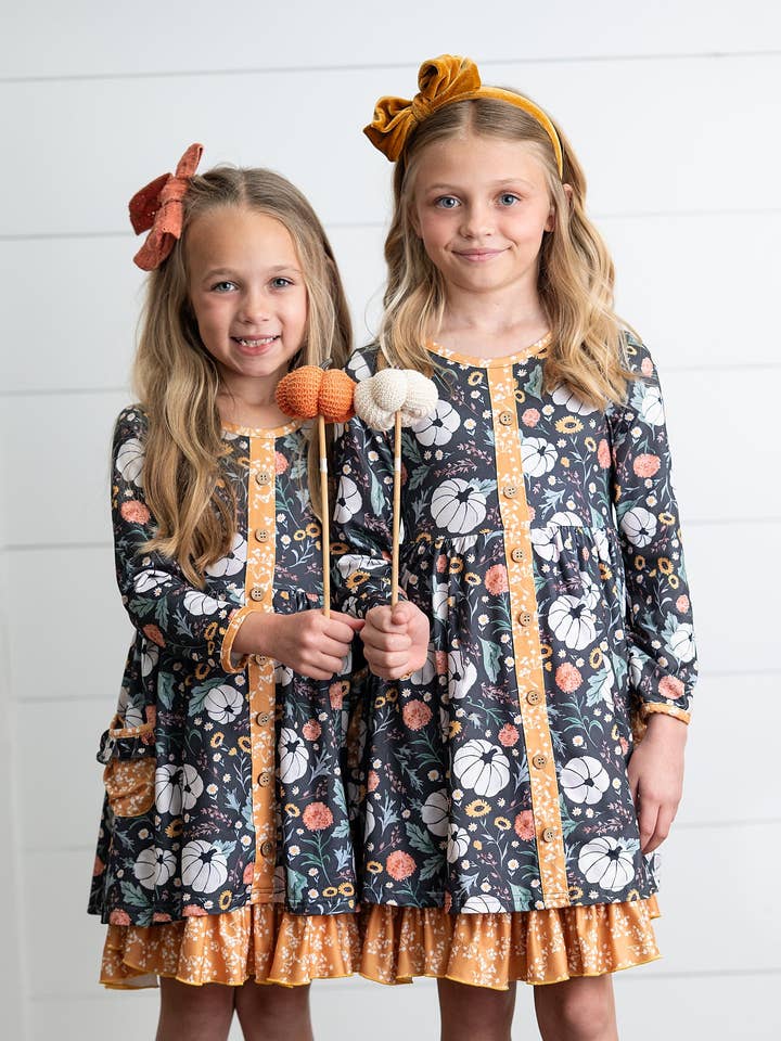 Girls Mustard Pumpkin Ruffle Pocket Button Tie Fall Dress for wholesale by Oopsie Daisy