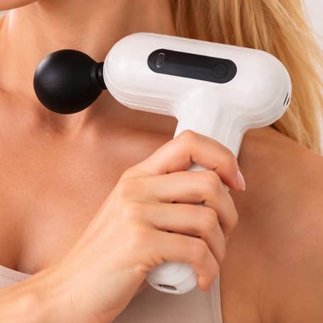 Mini masseur, masseur à percussion portable, rechargeable pour la vente par Dan Adora