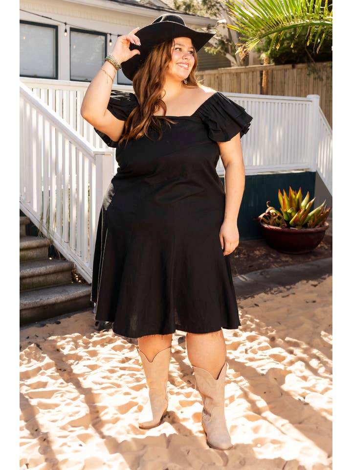 The Stella Black Linen Versi Dress for wholesale on Faire