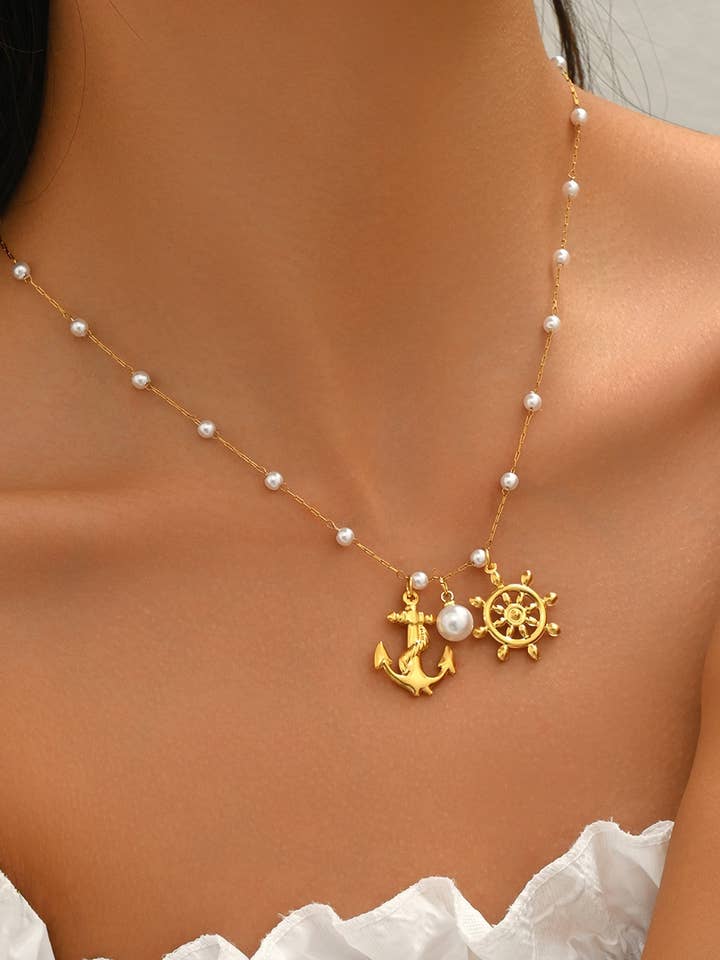 Golden Nautical Necklace – White Beads, Anchor & Helm for wholesale by COSMOS