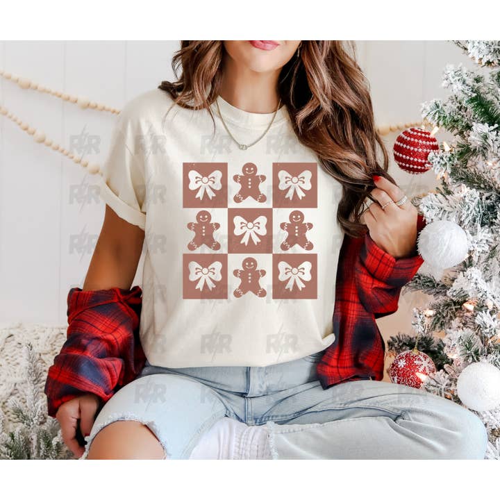 Checkered Gingerbread & Bow Pattern Cream Tee for wholesale by The Red Rival Wholesale