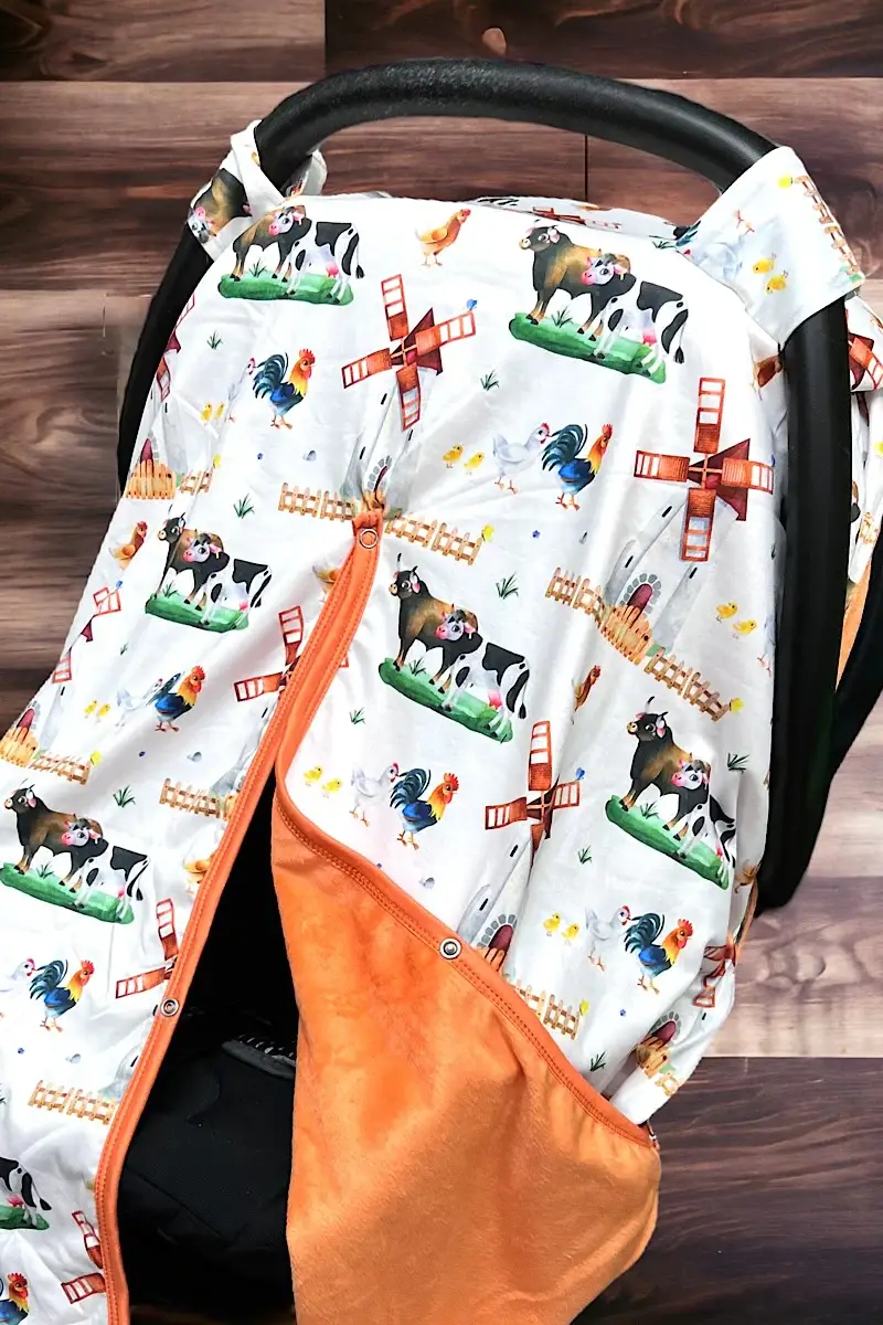 Wholesale COW PRINTED CARSEAT COVER W/ORANGE SOFT FABRIC. ZYTB25133006