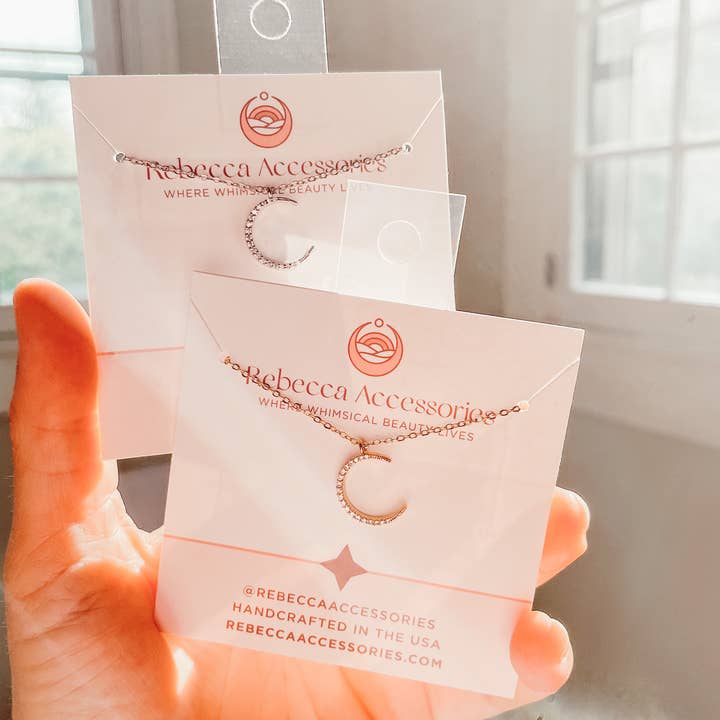 Rebecca Accessories LLC - Vendita all'ingrosso Parure di gioielli - Etichette trasparenti con gancio da aggiungere ai gioielli cardati