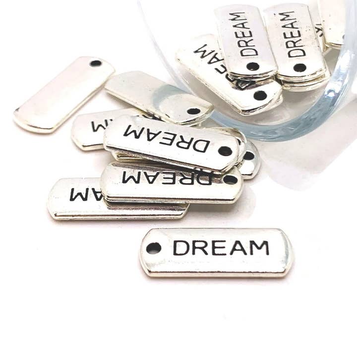 Silver Dream Word Bar Tag Charms, 8x21mm for wholesale by Guerrilla Charm