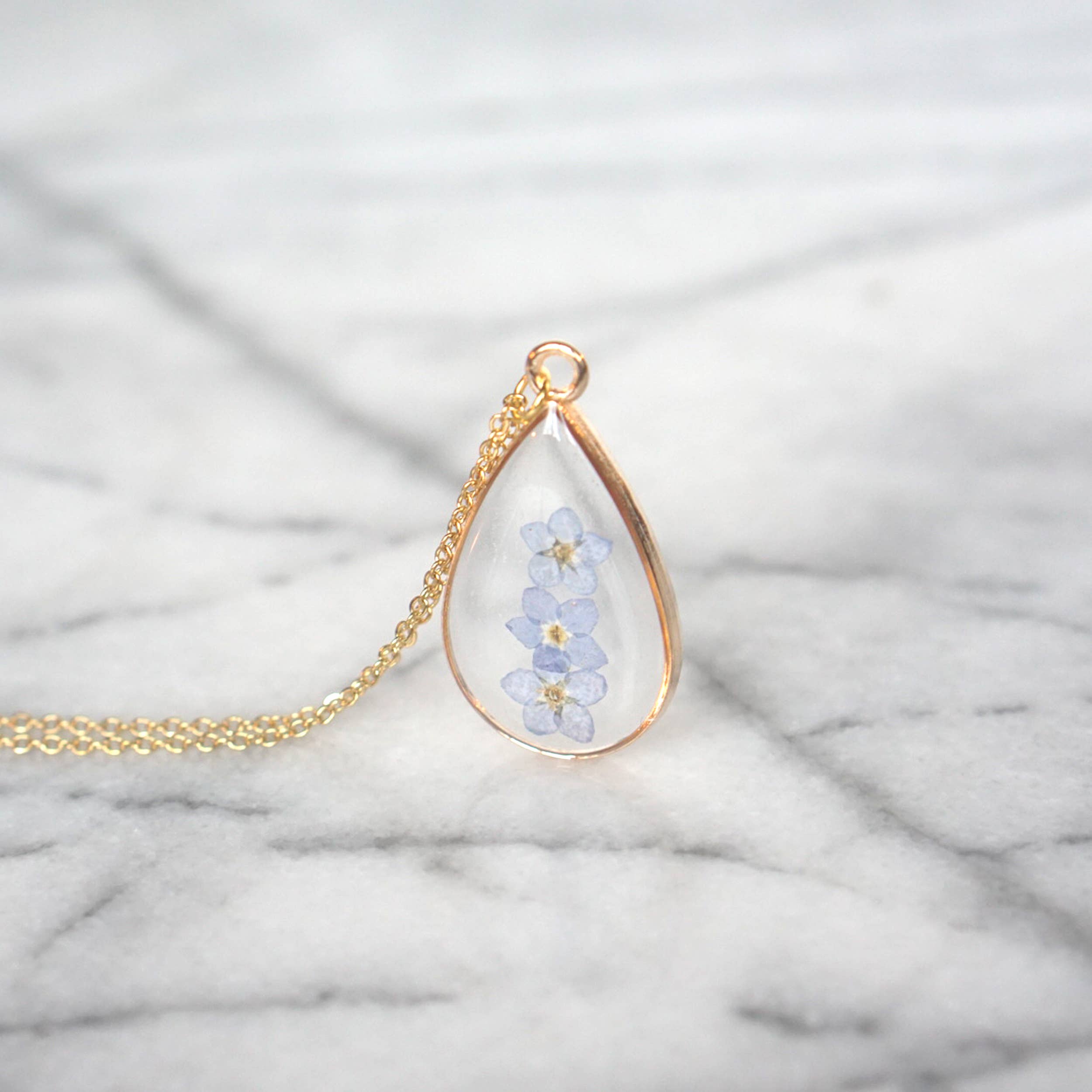 The Pretty Pickle - Wholesale Pendant/Charm Necklace - Forget Me Not Flower Necklace- Gold Plated1