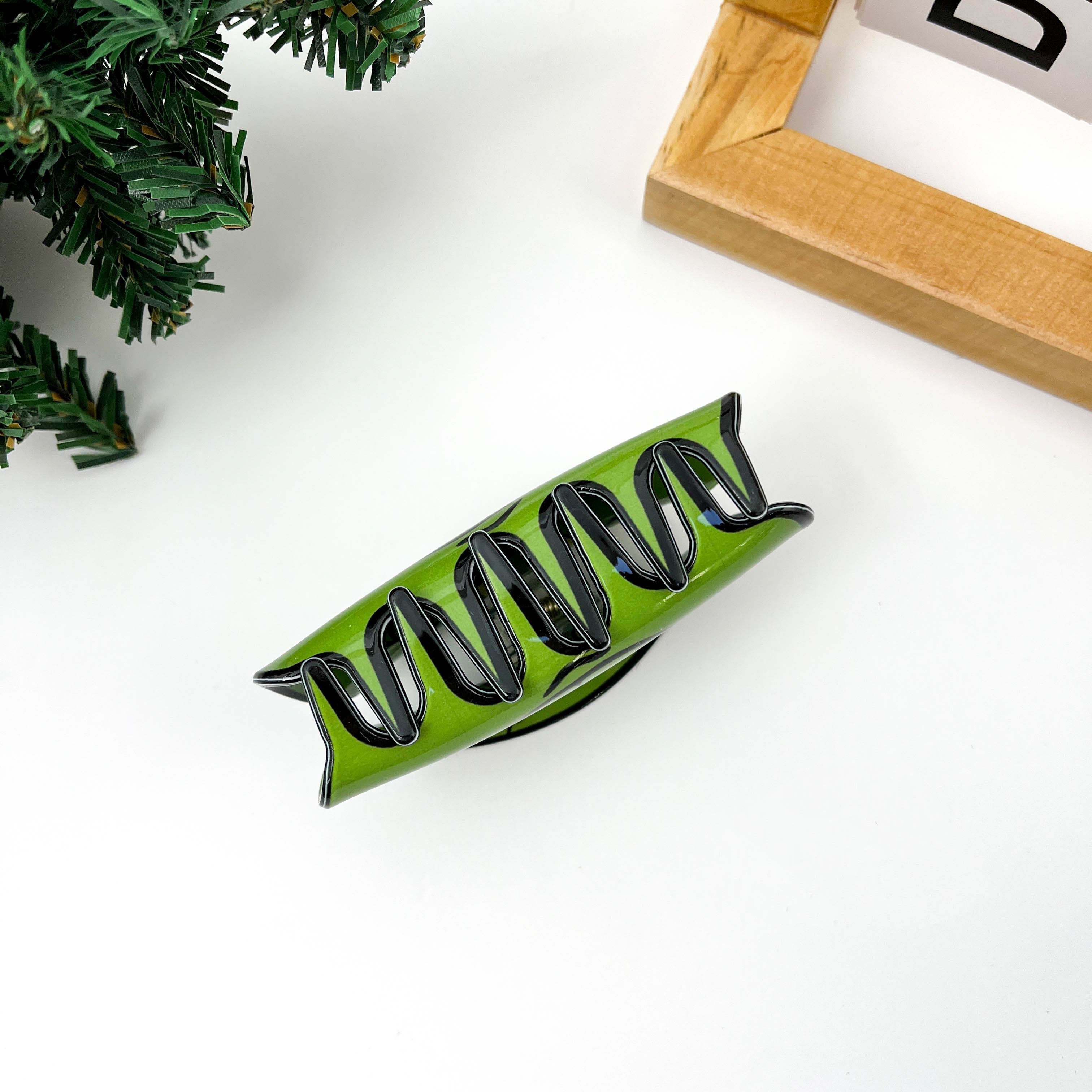 Groen Green Goblin gezicht haarclip met klauw voor groothandel op Faire2